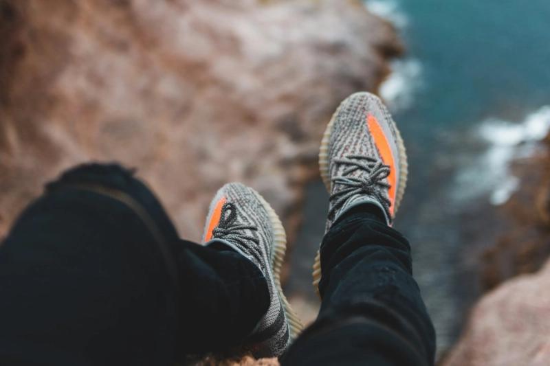 Feet hanging over cliff edge